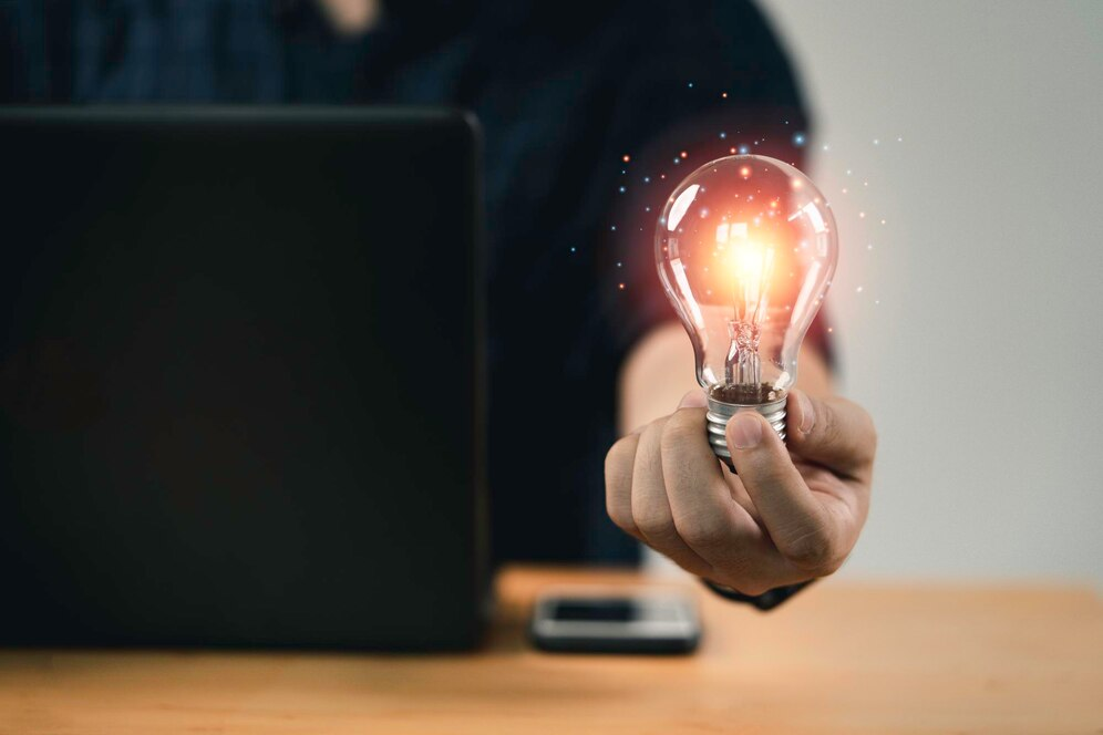 Man holding a light bulb